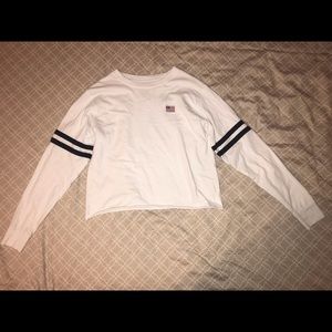 A White cropped long sleeved tee shirt from PacSun